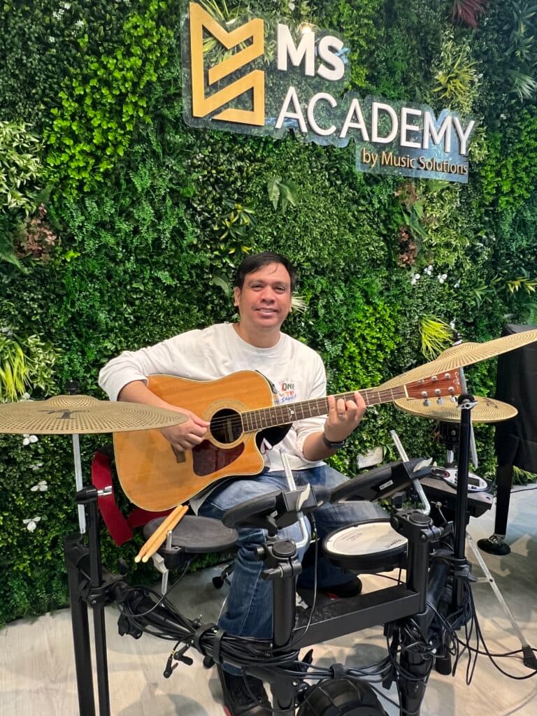 Portrait of Kenneth, multi-instrument educator at MS Academy